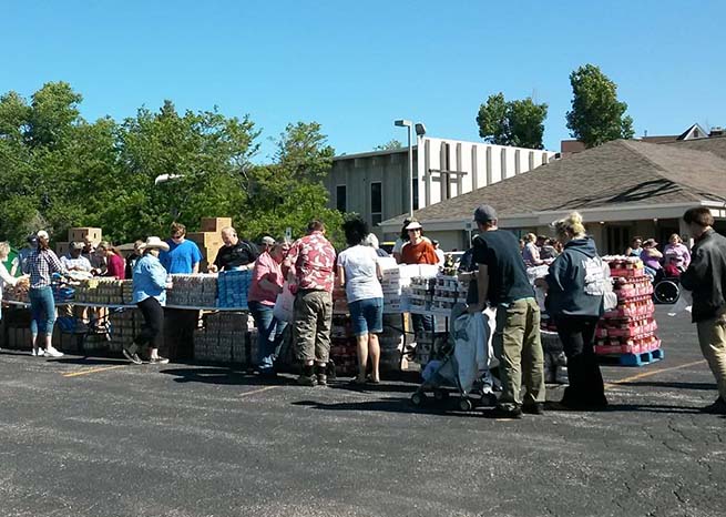 many people in line at food distribution event outside