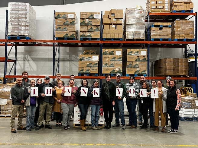 wyoming food bank team holding up "thank you" sign