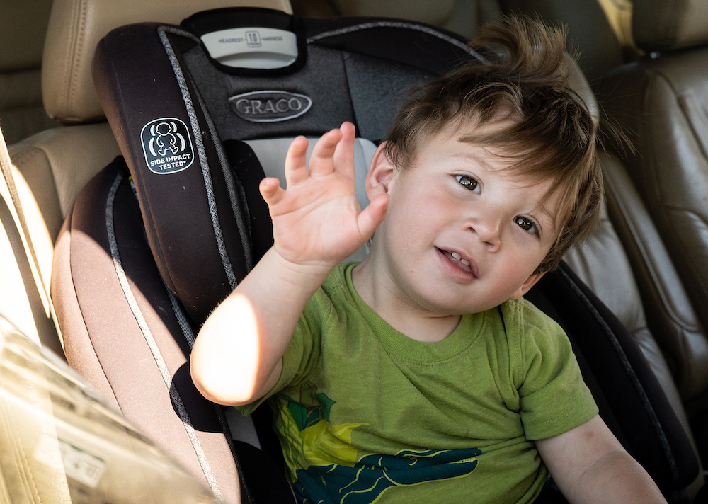 a child in car seat at a mobile food pantry in WY