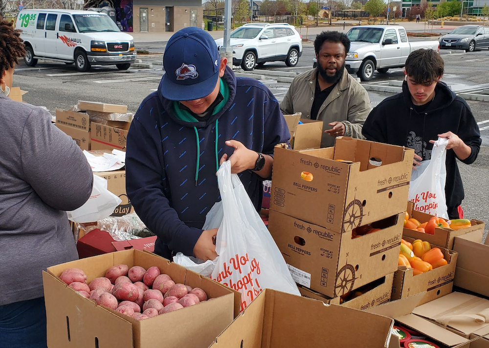 community members receiving nourishing food at a mobile food pantry location