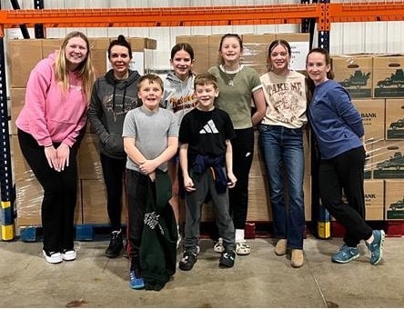 a family volunteering at the Food Bank of Wyoming