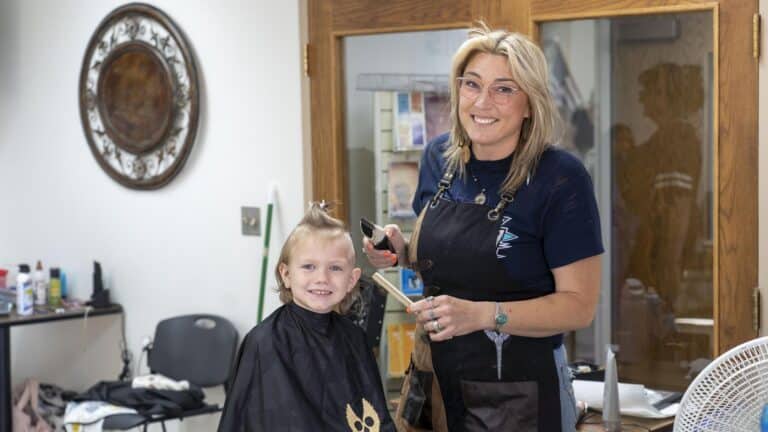 a young child getting a haircut