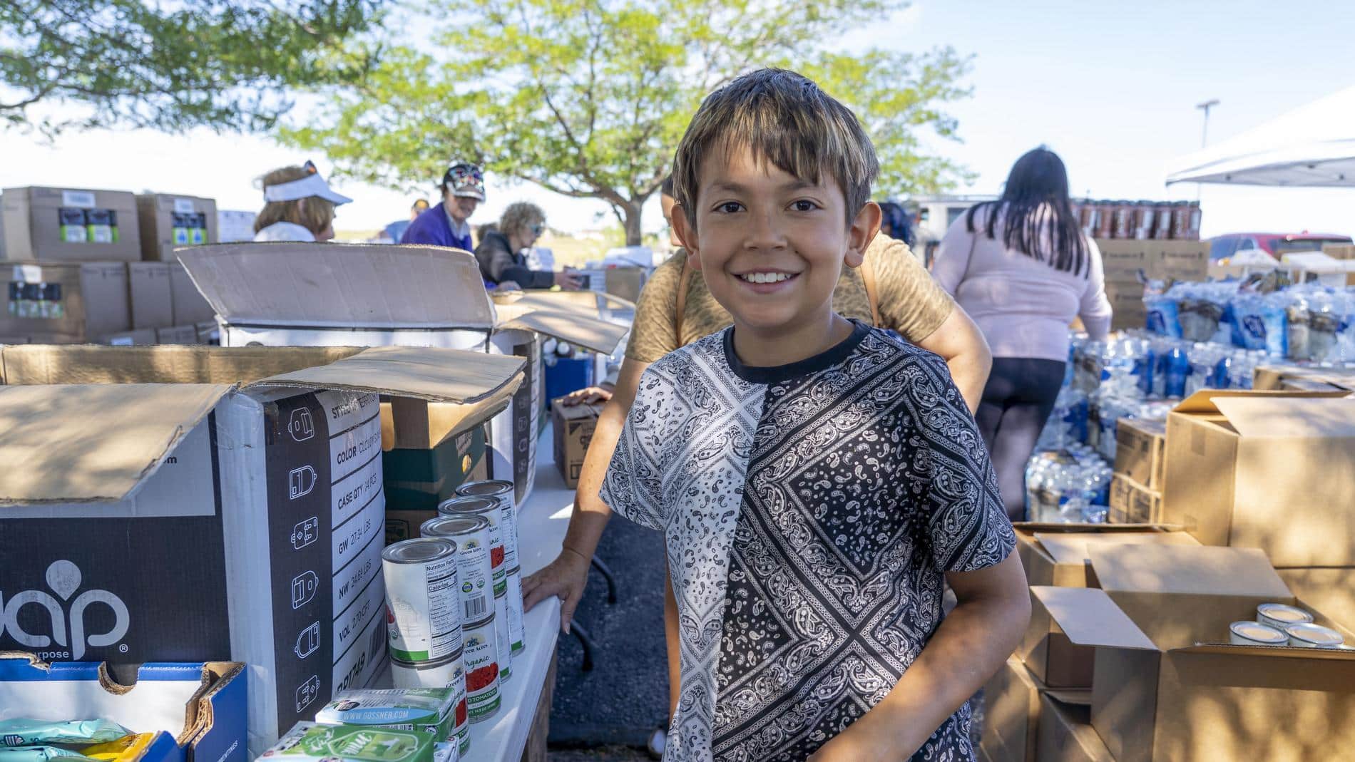 a boy oustide at a mobile food pantry in WY