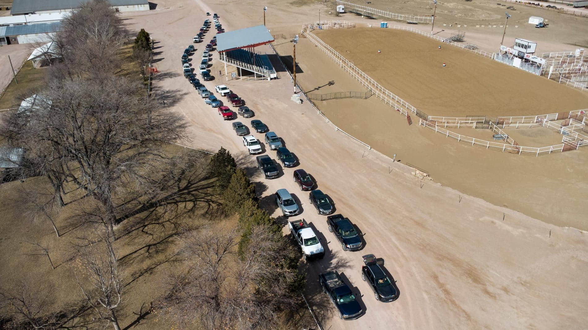 Birds eye view of line of cars at Newcastle rodeo grounds.